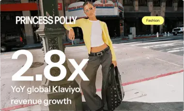 Woman in a yellow cardigan and grey pants stands on a city street holding a black bag. Text: "Princess Polly 2.8x YoY global Klaviyo revenue growth.