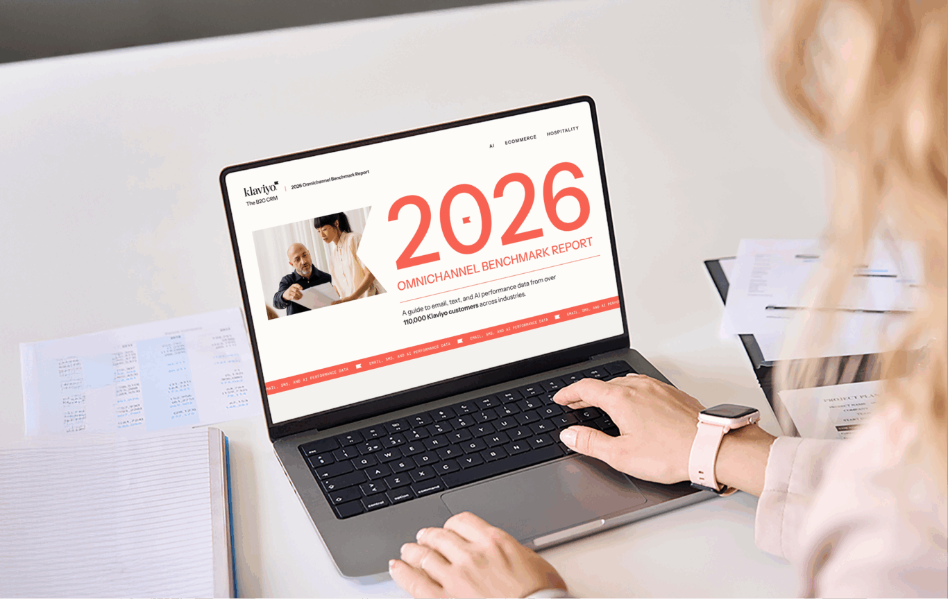 Person using a laptop displaying the "2026 Omnichannel Benchmark Report" by Klaviyo.