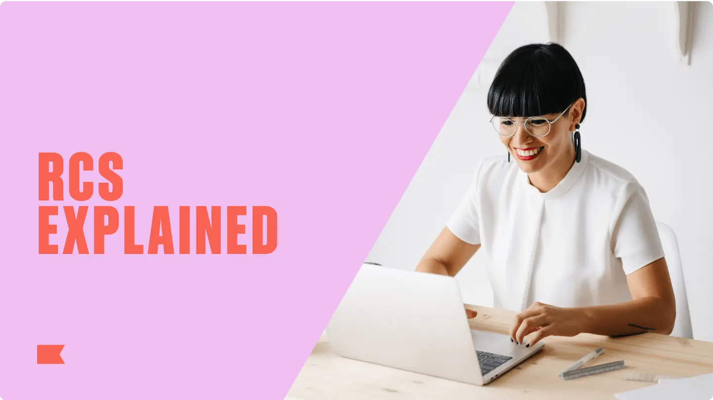 "RCS explained" against pink background, next to an image of someone sitting and smiling while looking at their laptop