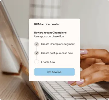 RFM action center interface on a laptop screen, showing options to create a Champions segment and post-purchase flow.